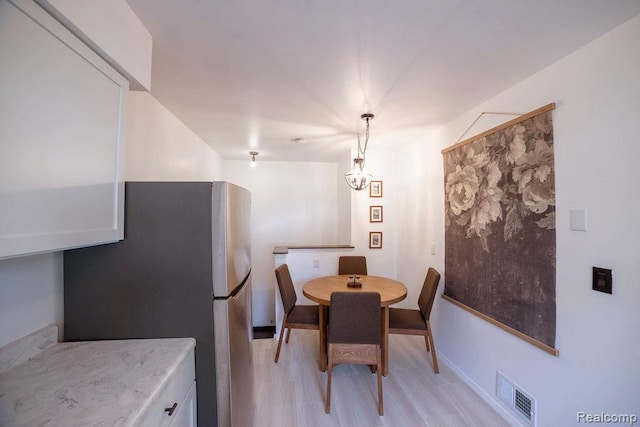 8220 Rivard Ave, Warren, MI 48089 - dining room featuring a chandelier and baseboards