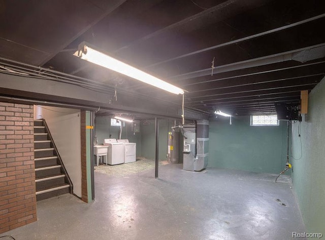 8220 Rivard Ave, Warren, MI 48089 - below grade area featuring heating unit, water heater, washer and dryer, and stairway