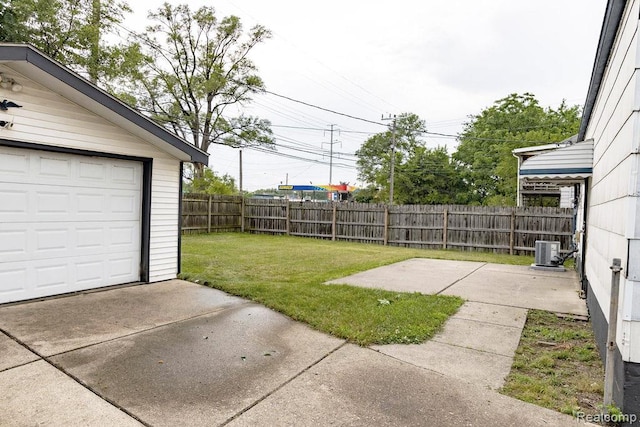 8220 Rivard Ave, Warren, MI 48089 - fenced backyard featuring a patio and a garage