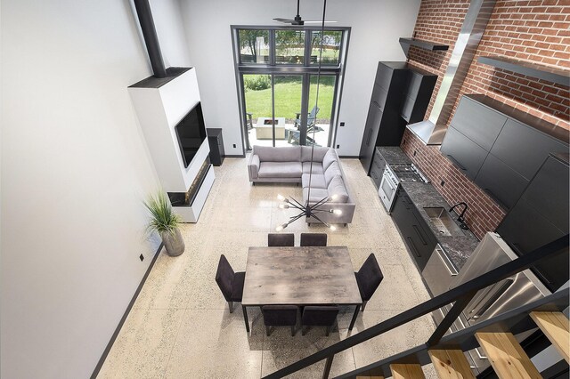 220 King St Unit 6, Lowell, MI 49331 - living area featuring a high ceiling and a ceiling fan