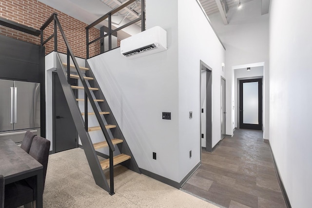 220 King St Unit 6, Lowell, MI 49331 - stairway with a towering ceiling and a wall mounted air conditioner