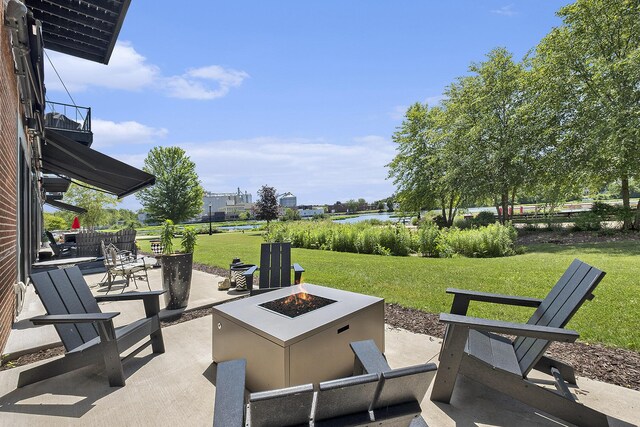 220 King St Unit 6, Lowell, MI 49331 - view of patio with an outdoor fire pit and a water view