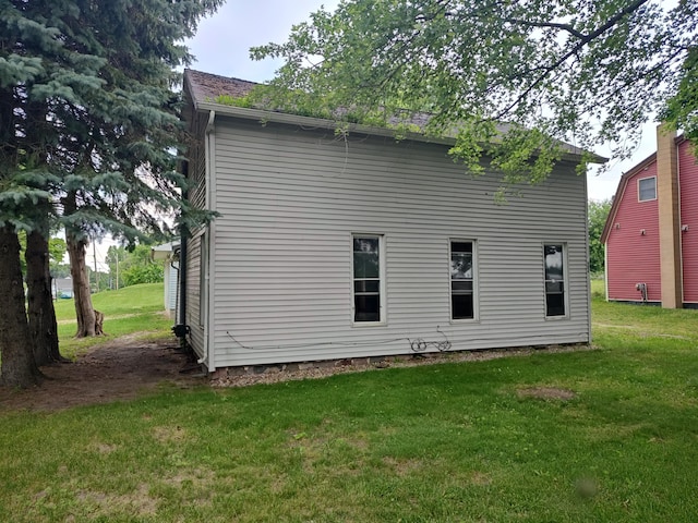 203 E Home St, Edmore, MI 48829 - back of house with a yard