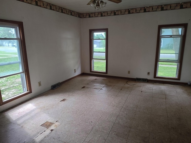 203 E Home St, Edmore, MI 48829 - empty room featuring ceiling fan and baseboards