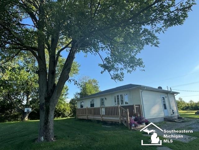 13091 Rosedale Blvd, Carleton, MI 48117 - back of house featuring a yard and a deck