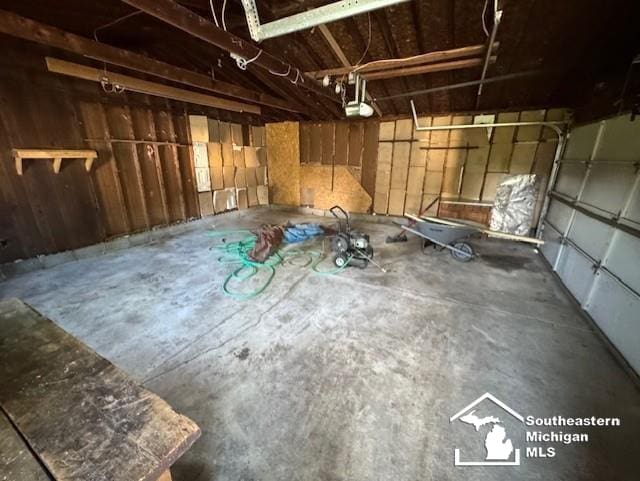 13091 Rosedale Blvd, Carleton, MI 48117 - garage featuring a garage door opener