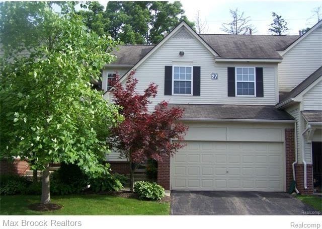38351 Churchill, Farmington Hills, MI 48331 - view of front of home with brick siding, driveway, a garage, and a shingled roof