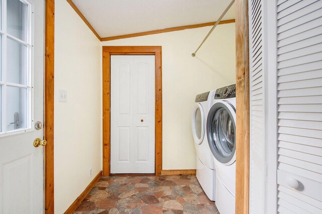 2919 N US Highway 31, Niles, MI 49120 - washroom featuring washer and clothes dryer, crown molding, and stone finish flooring