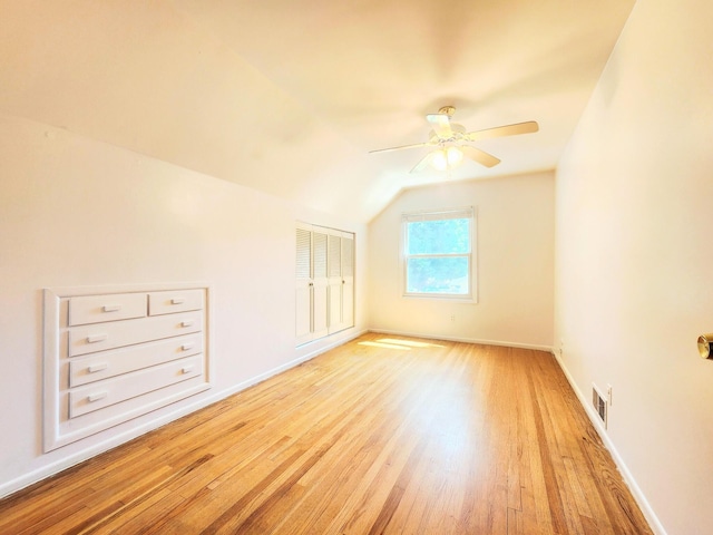 671 Lonesome Pine Trl, Saint Joseph, MI 49085 - additional living space featuring light wood finished floors, a ceiling fan, and vaulted ceiling