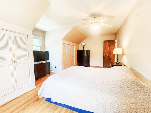 671 Lonesome Pine Trl, Saint Joseph, MI 49085 - bedroom with light wood finished floors, ceiling fan, and vaulted ceiling