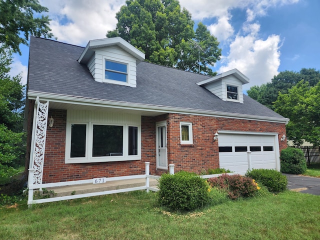 671 Lonesome Pine Trl, Saint Joseph, MI 49085 - cape cod-style house featuring brick siding, an attached garage, driveway, and a shingled roof