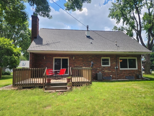 671 Lonesome Pine Trl, Saint Joseph, MI 49085 - rear view of house with a yard, a deck, brick siding, a chimney, and a shingled roof