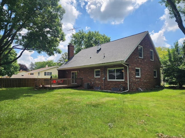 671 Lonesome Pine Trl, Saint Joseph, MI 49085 - rear view of property featuring brick siding, a chimney, and a wooden deck