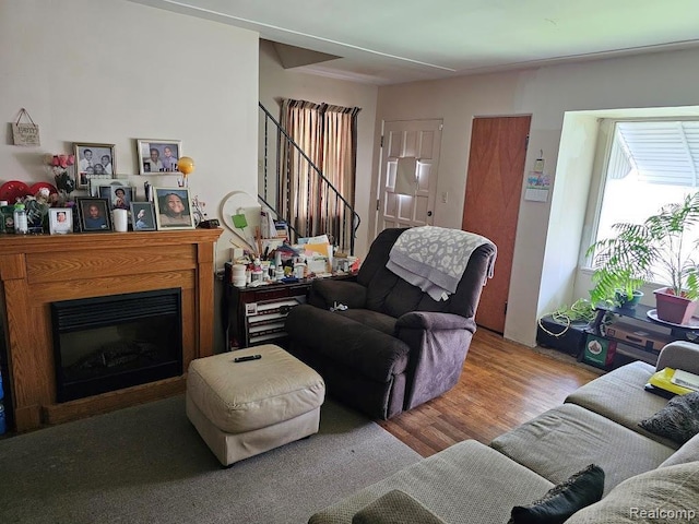 618 S Meade St, Flint, MI 48503 - living room featuring wood finished floors and stairway