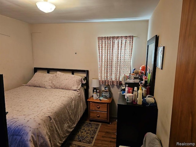 618 S Meade St, Flint, MI 48503 - bedroom featuring dark wood-style flooring
