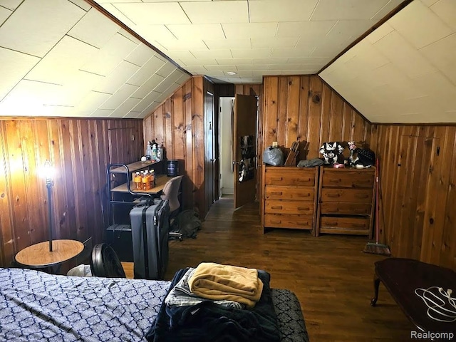 618 S Meade St, Flint, MI 48503 - bedroom with dark wood-style floors, wood walls, and vaulted ceiling