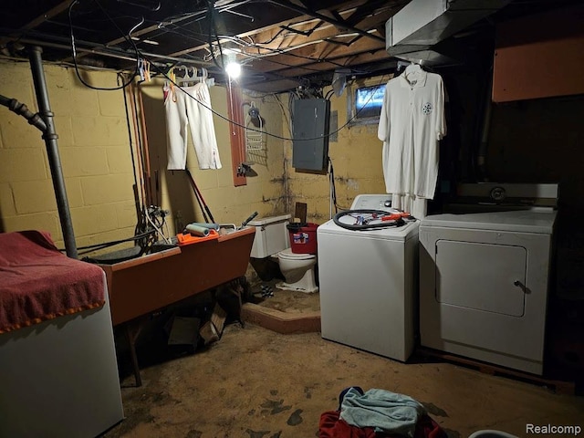 618 S Meade St, Flint, MI 48503 - unfinished basement featuring washer and dryer and electric panel