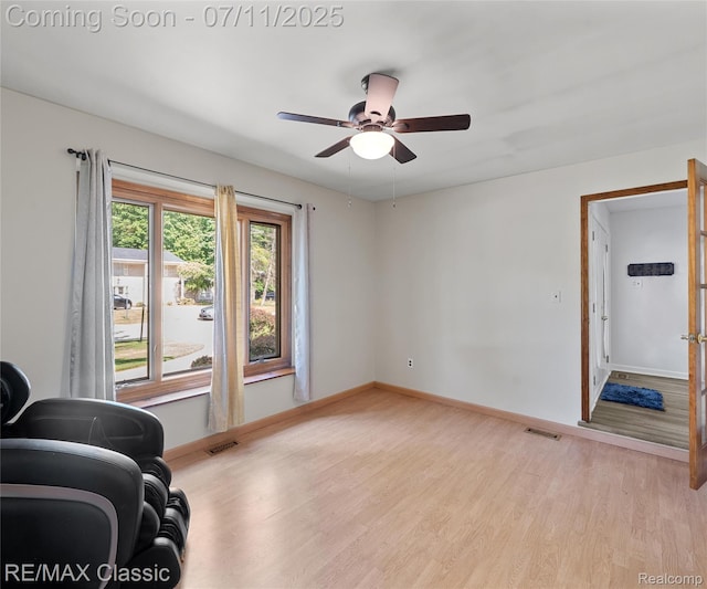 25067 Skye Dr, Farmington Hills, MI 48336 - unfurnished living room featuring light wood finished floors and ceiling fan
