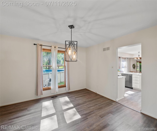 25067 Skye Dr, Farmington Hills, MI 48336 - unfurnished dining area with a chandelier, healthy amount of natural light, and light wood-style floors