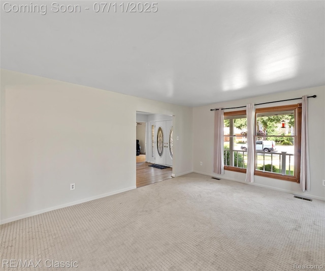 25067 Skye Dr, Farmington Hills, MI 48336 - empty room featuring light colored carpet and baseboards