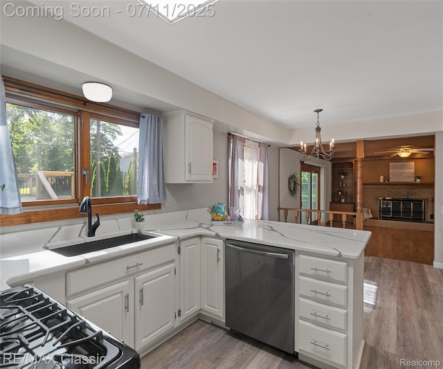 25067 Skye Dr, Farmington Hills, MI 48336 - kitchen featuring dishwasher, a peninsula, a chandelier, white cabinetry, and light wood-style flooring