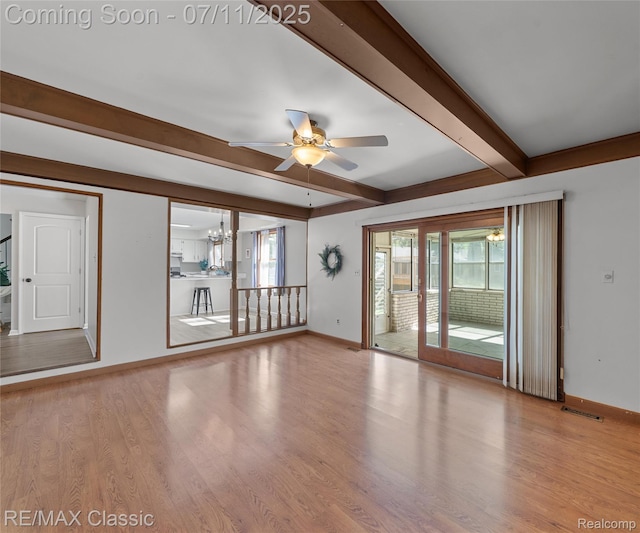 25067 Skye Dr, Farmington Hills, MI 48336 - spare room featuring beamed ceiling, ceiling fan, and wood finished floors
