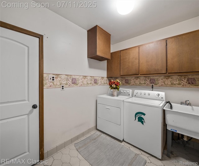 25067 Skye Dr, Farmington Hills, MI 48336 - laundry room featuring cabinet space, separate washer and dryer, a wainscoted wall, and light tile patterned floors