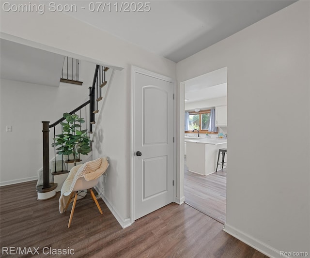 25067 Skye Dr, Farmington Hills, MI 48336 - stairs with wood finished floors and baseboards