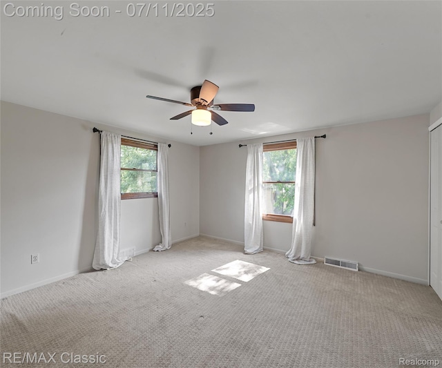 25067 Skye Dr, Farmington Hills, MI 48336 - carpeted empty room featuring ceiling fan and plenty of natural light