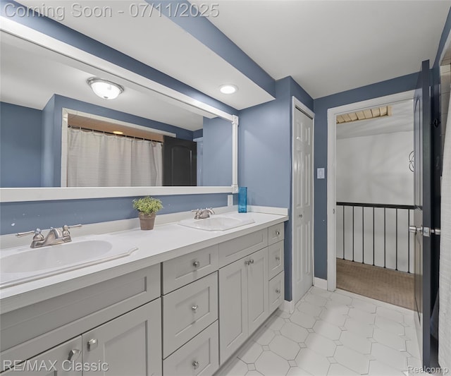 25067 Skye Dr, Farmington Hills, MI 48336 - full bathroom featuring double vanity and baseboards