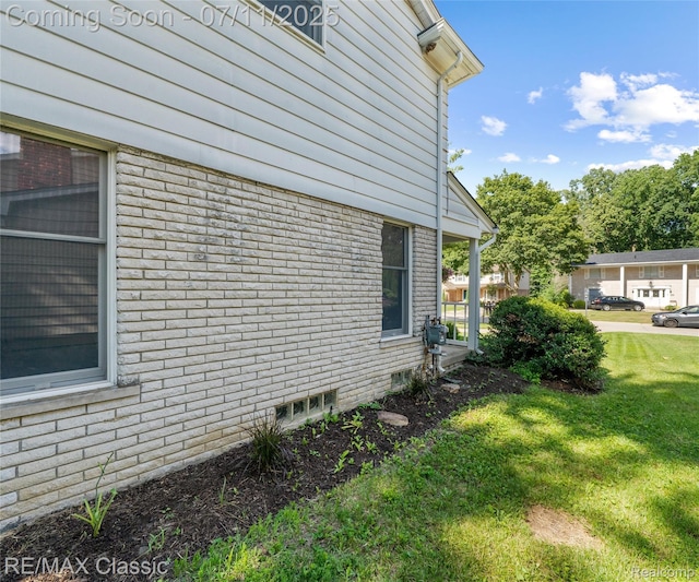 25067 Skye Dr, Farmington Hills, MI 48336 - view of side of property with a lawn and brick siding