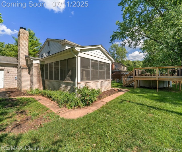 25067 Skye Dr, Farmington Hills, MI 48336 - view of side of home featuring a sunroom, a deck, brick siding, a yard, and stairway
