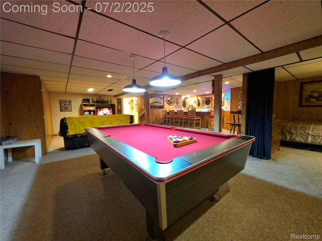 12137 Carol Ave, Warren, MI 48093 - playroom featuring a paneled ceiling, carpet, wooden walls, pool table, and bar area