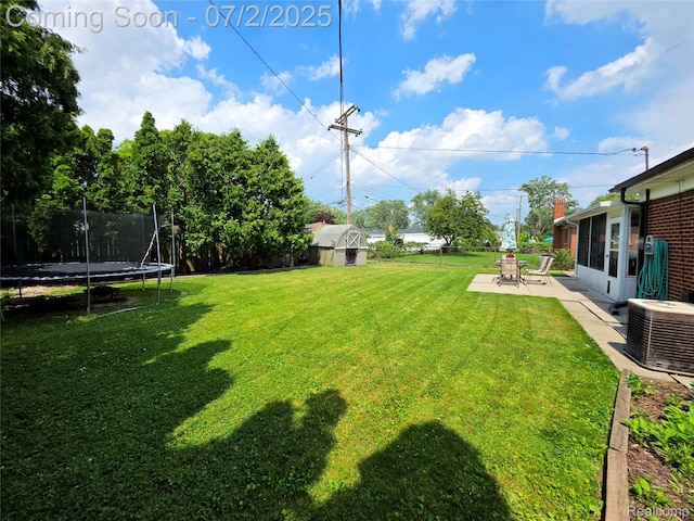 12137 Carol Ave, Warren, MI 48093 - view of yard with a trampoline and a patio area