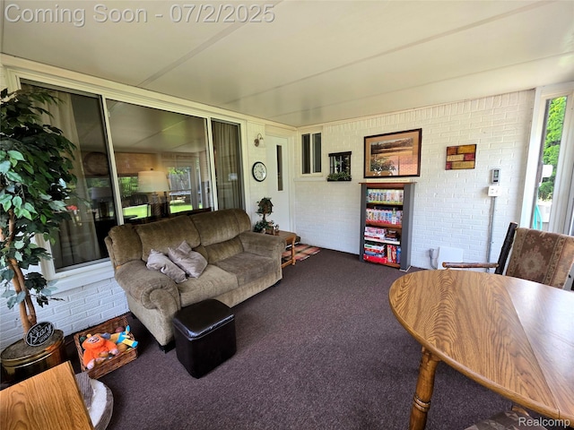 12137 Carol Ave, Warren, MI 48093 - carpeted living room featuring brick wall