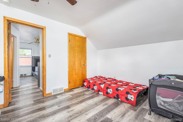 17237 Philomene Blvd, Allen Park, MI 48101 - bedroom featuring wood finished floors, vaulted ceiling, and a ceiling fan