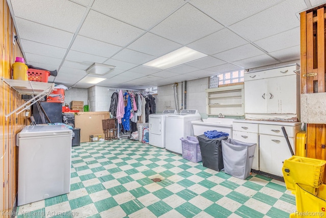17237 Philomene Blvd, Allen Park, MI 48101 - basement with washing machine and clothes dryer, refrigerator, concrete block wall, a drop ceiling, and light flooring