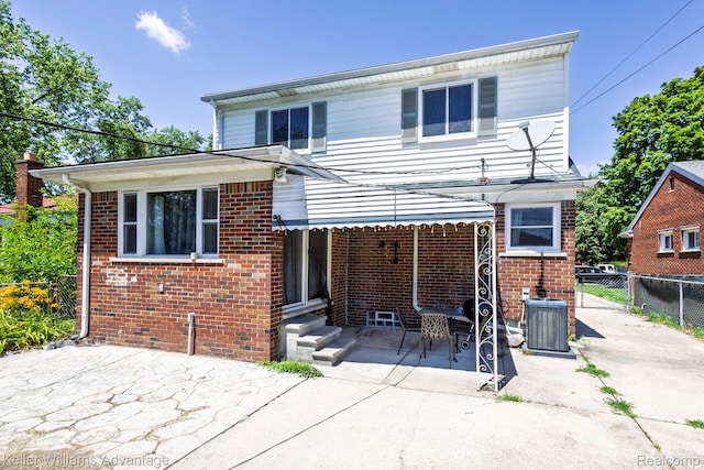 17237 Philomene Blvd, Allen Park, MI 48101 - rear view of house with brick siding, a patio, and entry steps
