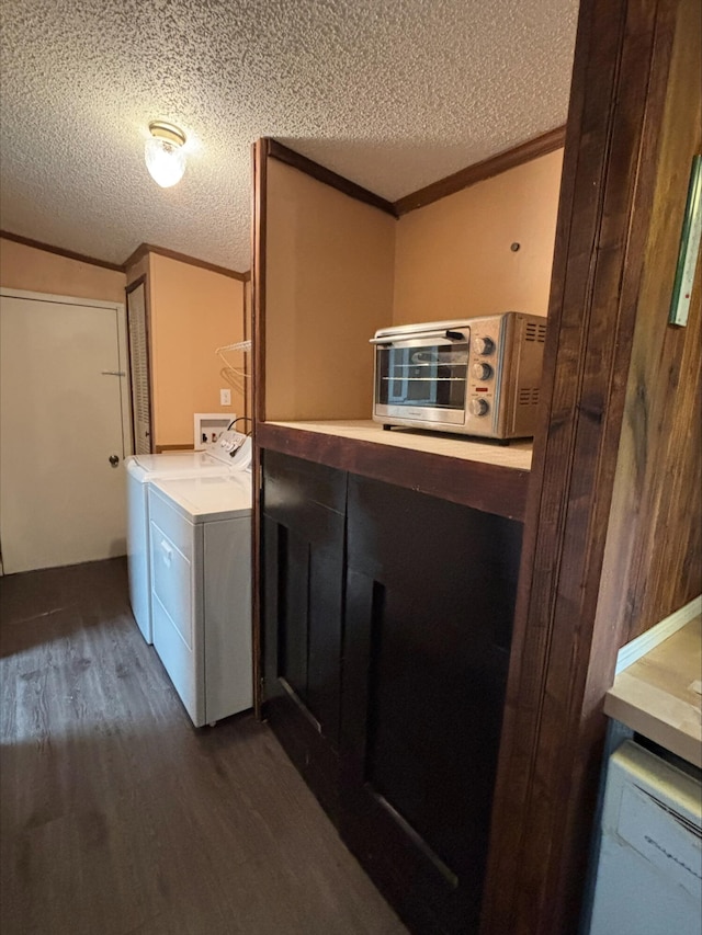 9670 Sayers Rd, Munith, MI 49259 - washroom featuring dark wood-style floors, separate washer and dryer, a textured ceiling, and ornamental molding