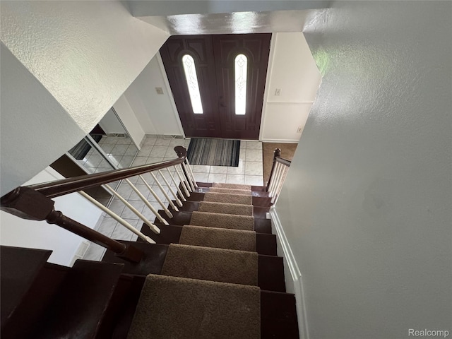 28240 Lahser Rd, Southfield, MI 48034 - stairs with tile patterned floors and a textured wall