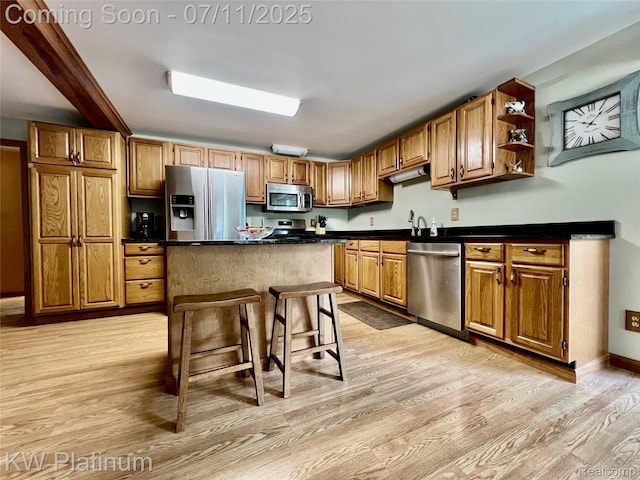 2243 Sunnyside Rd, Kimball, MI 48074 - kitchen featuring stainless steel appliances, light wood-style flooring, dark countertops, a center island, and open shelves