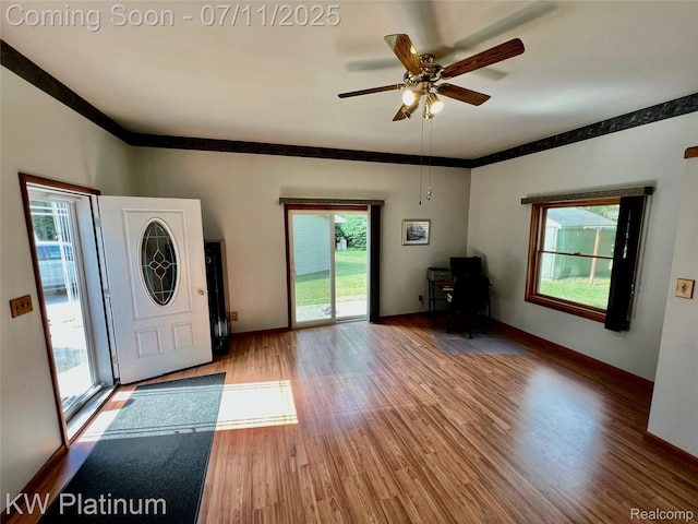 2243 Sunnyside Rd, Kimball, MI 48074 - foyer with wood finished floors, ceiling fan, and crown molding