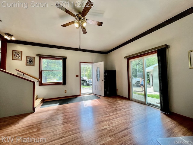 2243 Sunnyside Rd, Kimball, MI 48074 - unfurnished living room with wood finished floors, ceiling fan, and crown molding