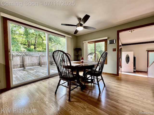 2243 Sunnyside Rd, Kimball, MI 48074 - dining area with stacked washer / dryer, wood finished floors, and ceiling fan