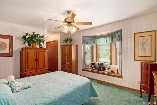 10363 E Bristol Rd, Davison, MI 48423 - bedroom with wallpapered walls, carpet, a ceiling fan, and a closet