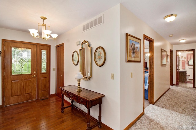 10363 E Bristol Rd, Davison, MI 48423 - foyer entrance featuring a chandelier and wood-type flooring