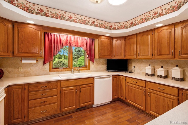 10363 E Bristol Rd, Davison, MI 48423 - kitchen featuring dishwasher, light countertops, tasteful backsplash, and brown cabinetry