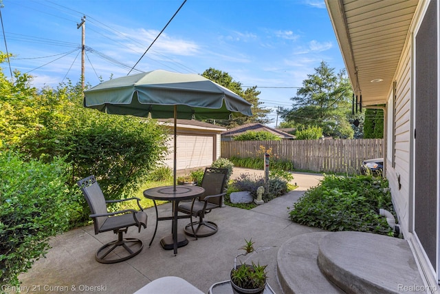 17729 Harman St, Melvindale, MI 48122 - view of patio / terrace featuring an outbuilding and a detached garage