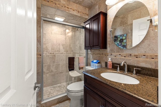17729 Harman St, Melvindale, MI 48122 - full bathroom featuring vanity, a stall shower, and tile walls