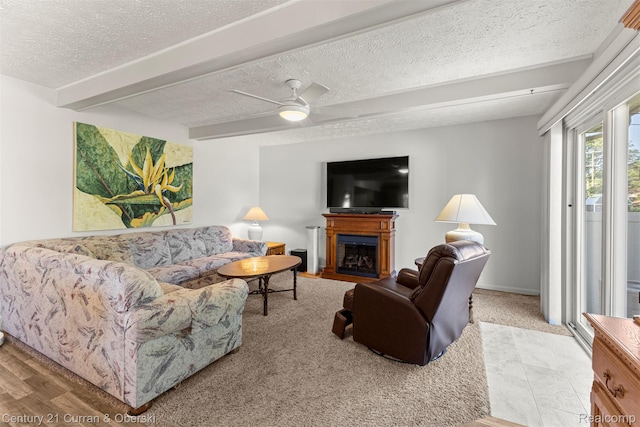 17729 Harman St, Melvindale, MI 48122 - living area with a textured ceiling, a fireplace, and a ceiling fan